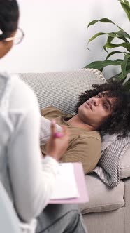 Man Talking to Lady Psychologist During Session