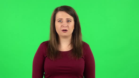 Portrait of Frightened Girl Says Wow with Shocked Facial Expression. Green Screen