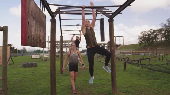 Young adults training at an outdoor gym bootcamp