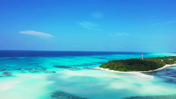 Aerial drone shot scenery of tranquil bay beach trip by clear lagoon and clean sandy background of a