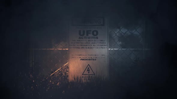Ufo Activities Warning Sign On A Fence In A Storm