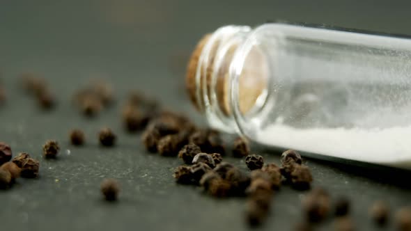 Salt and pepper shaker on black background 4k