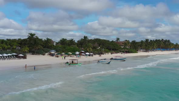 Aerial View of a Group of Fisher Boats Moored on a Tropical Beach in Tulum, Mexico