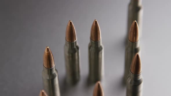 Cinematic rotating shot of bullets on a metallic surface - BULLETS 003