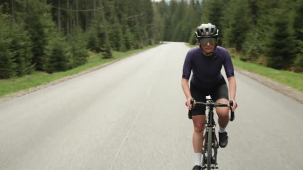 Hard training on bicycle. Cyclist doing cardio workout training on bike, preparing for competition.