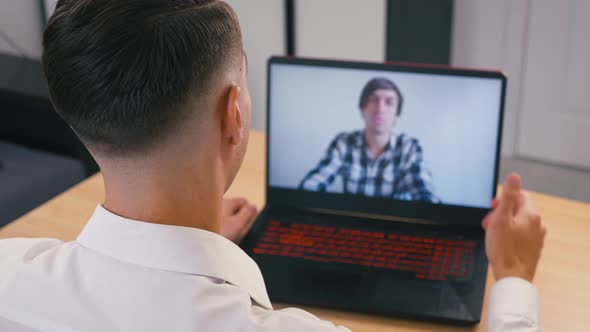 Online Conference. A Business Man Greets His Work Colleague and Communicates with Him Remotely From