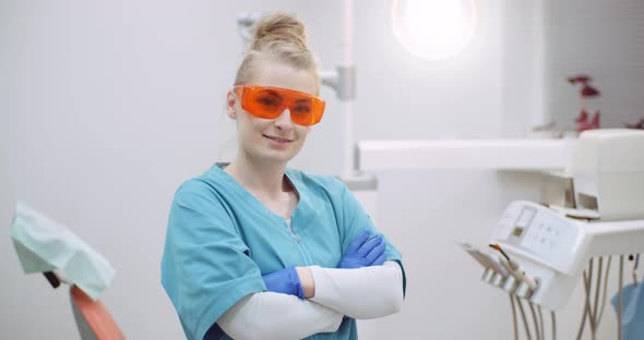 Female Doctor Wearing anti-UV Glasses in Healthcare Clinic