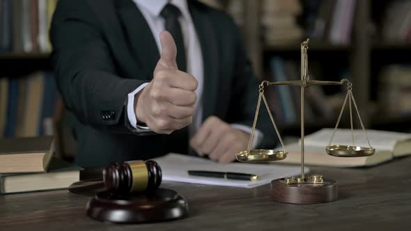 Close Up Shoot of Judge Hand Showing Big Thumbs Up in Court Room