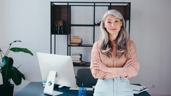 Confident Stylish Mature Businesswoman Portrait with Office Background