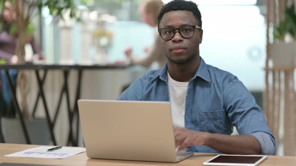 No Gesture with Finger By Young African Man in Modern Office