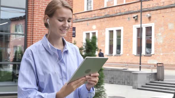 Online Video Chat By Woman Walking on Street