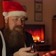 Full Bearded Man with Santa Hat Drinks - VideoHive Item for Sale