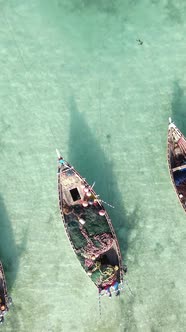 Vertical Video Boats in the Ocean Near the Coast of Zanzibar Tanzania