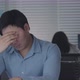 Tired Male Office Worker Sitting at desk concentrated on his work - VideoHive Item for Sale