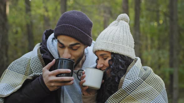 Closeup Young Happy Couple in Love Tourists Travelers Stand Outdoors Drinking Tea Warm Up Hot Drink