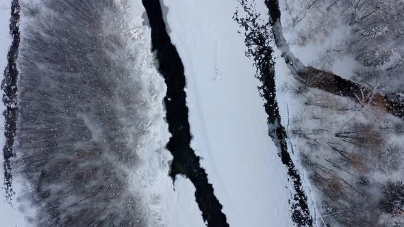 Snowy Streams Between Woodland At Winter In Bialka Tatrzanska, Poland. - aerial