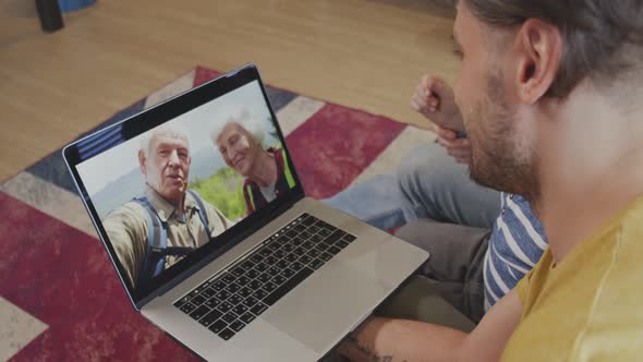 Same-Sex Family with Kid Talking to Grandparents on Video Call