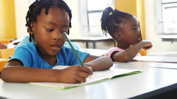 School kids studying in classroom