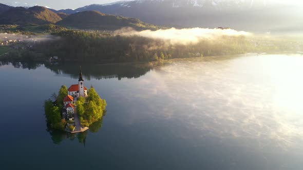 Flying over lake Bled towards the hills and mountains