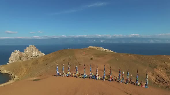 Aerial Over Sacred Wooden Shaman Columns with Colourful Ribbons Close to Shamanka Rock Olkhon Island