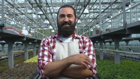 Successful Farmer Looking to Camera and Making Thumbs-Up Gesture Product Quality