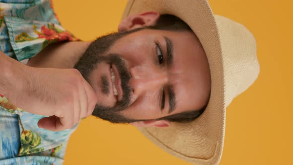 Closeup Portrait of Latin Young Man Who Shakes His Head Suspiciously Smiles and Looks at the Side