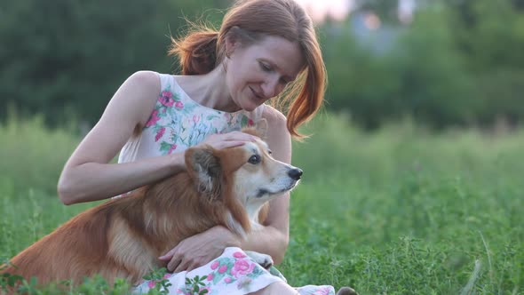 Smiling Woman With A Dog In The Field 2