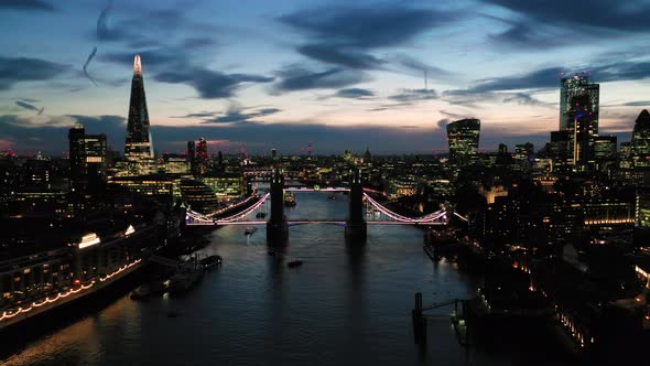 Aerial View of London over the River Thames flying towards Tower Bridge, Shard and the Tower of Lond