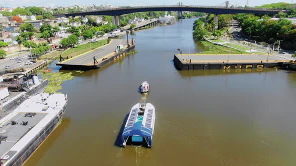 View of the 004 interceptor towed by another boat in the ozama river, Santo Domingo