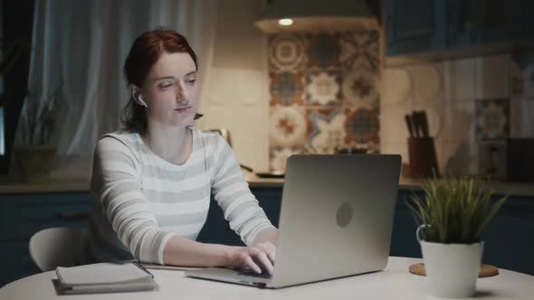 Woman In The Kitchen With Laptop, Woman Tired, Her Head Hurts