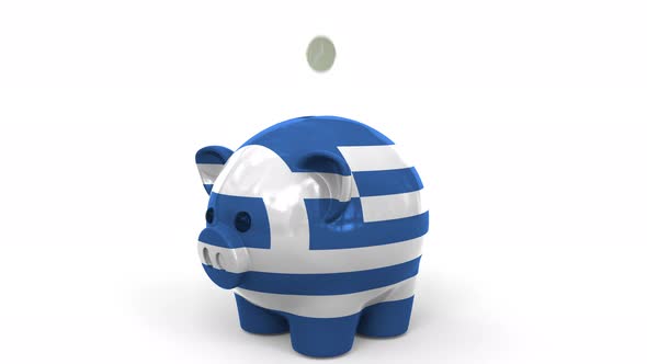 Coins Fall Into Piggy Bank Painted with Flag of Greece