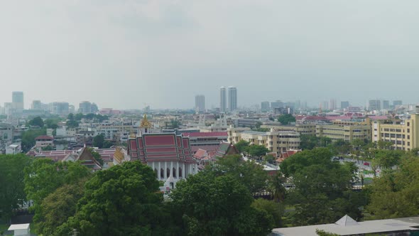 4K Urban landscape shot of a panoramic view of Bangkok, Thailand on a sunny day, from the top of the
