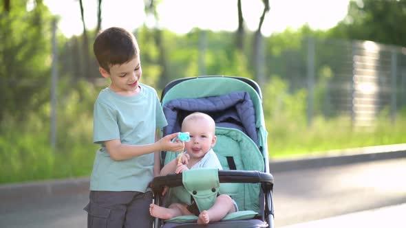 Preschooler Boy Playing with Baby Brother