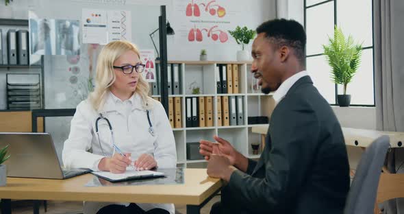 Man Visiting Professional Skilled Female Local Doctor and Complaining