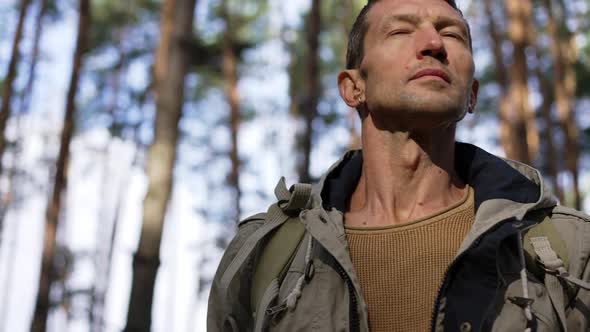 Portrait of Worried Lost Tourist Standing at Sunset in Forest Calling for Help in Slow Motion