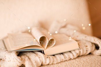 Open book with folded pages in heart shape