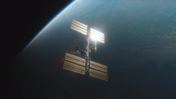 Animation of the International Space Station ISS Floating in Orbit Above Planet Earth in Outer Space