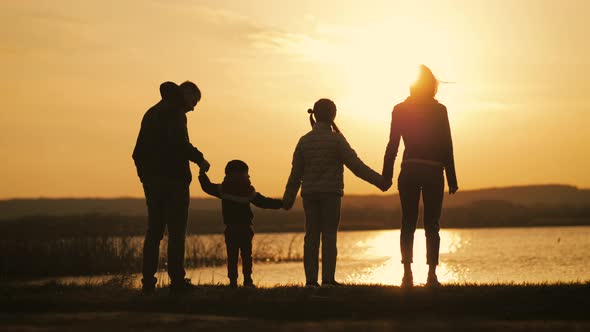 Silhouette of Family at the Coast