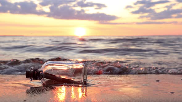 Message in the Bottle against the Sun Setting Down