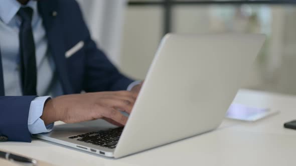 Businessman Typing on Laptop Close Up