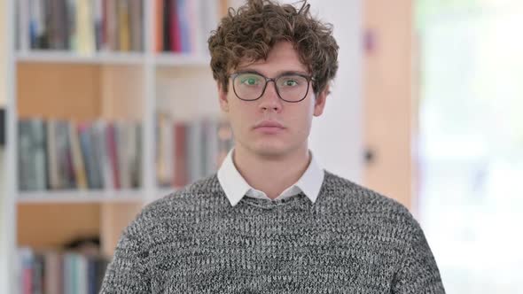 Portrait of Young Man Looking at Camera