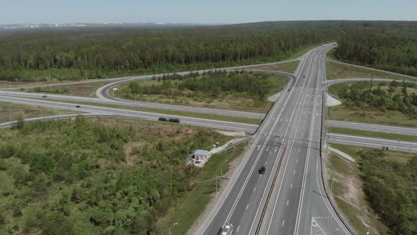 Military Vehicles Are on the Side of the Road in Front of the Bridge. Aerial View 