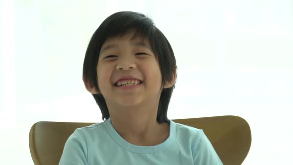 Close Up Of Happy Asian Child Outdoor Slow Motion