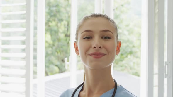 Female doctor smiling to camera