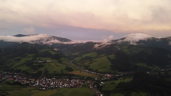 Foothill Village in a Hilly Landscape After the Rain at Sunset