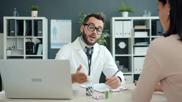 Man and Woman Patient and Doctor Talking Discussing Treatment Then Shaking Hands