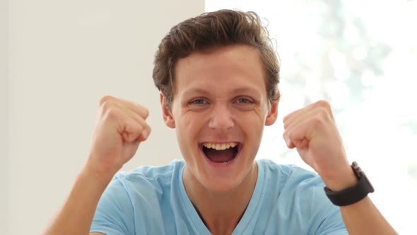 Success, Excited young Man Overwhelmed by Results