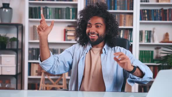 Cheerful Indian Man Office Worker Rejoices and Throws Airplane Made of Paper