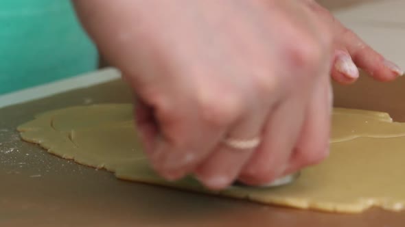 The Woman Rolls Out The Dough. Cooking Marshmallow Sandwiches. Close Up Shot.