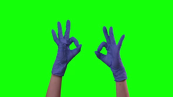 Doctors Female Hands in Blue Glove Is Making Gestures Ok
